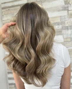 Teddy Blonde to Bronde Balayage Hair Colour on long wavy hair